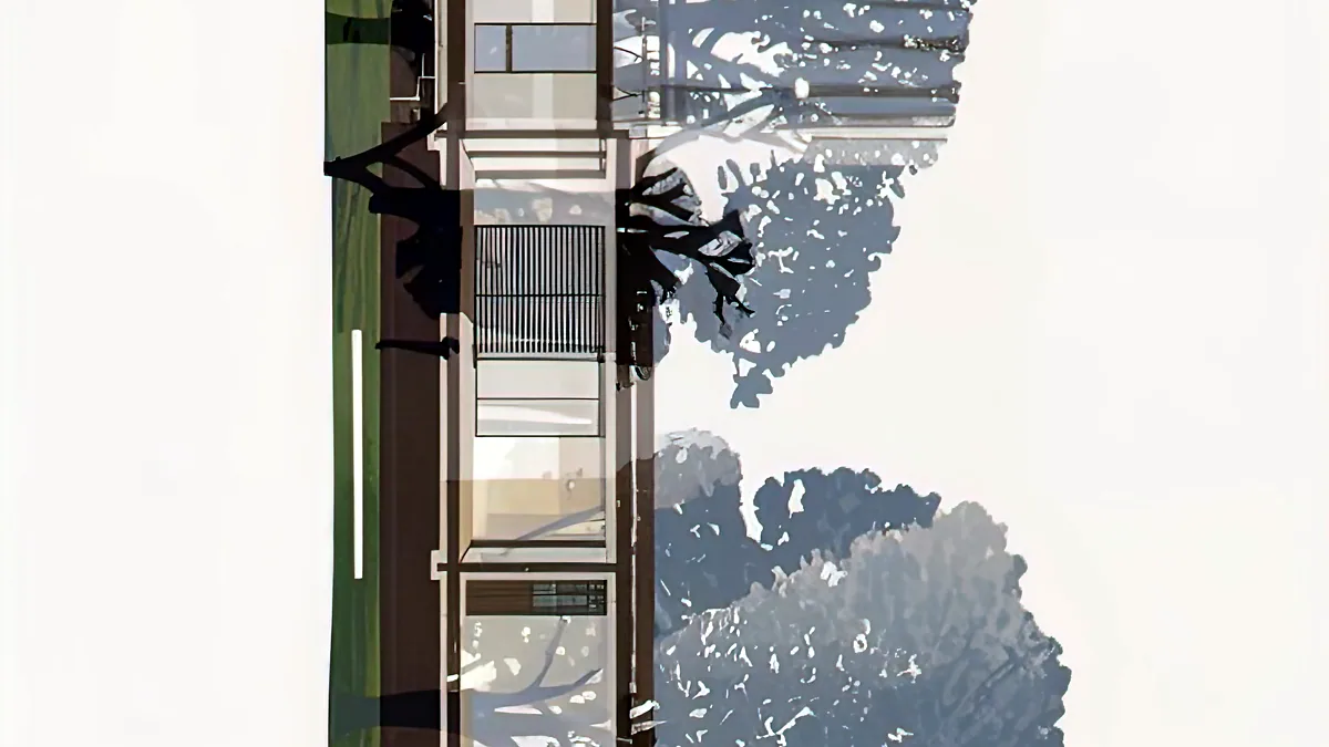 A suburban house reflected twice in a dark window.